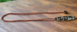 Guru Rinpoche Three Eyed Dzi Bead