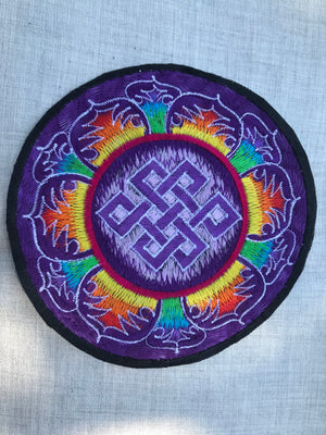 Endless knot in rainbow petals