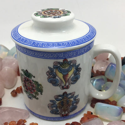 Potala Gate Tibetan cup with blue brocade borders and the 8 auspicious symbols